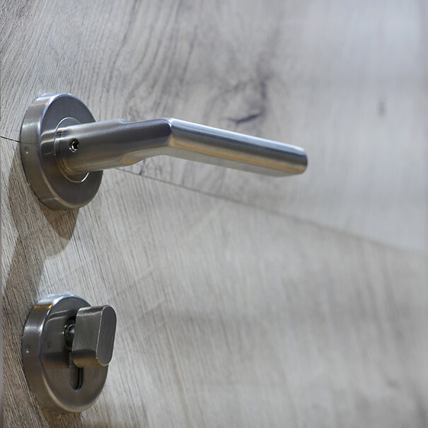 Close up photo of modern door handle and lock